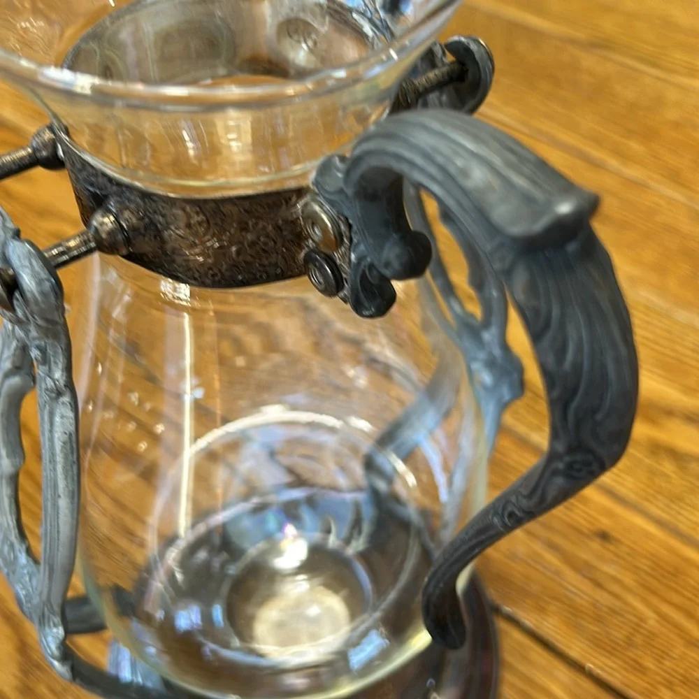 Vintage silver plated tilting coffee stand and carafe. No markings. Glass carafe
